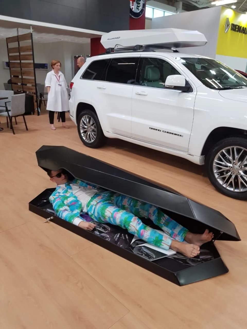Person in Alumined box at auto show