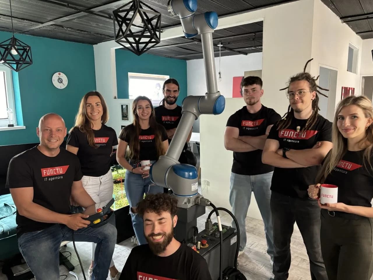 FUNCTU team with robot in office