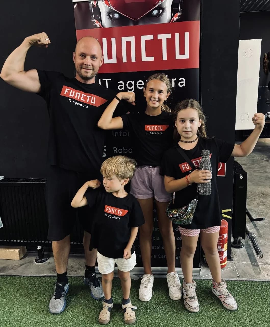 Juraj with children in FUNCTU shirts