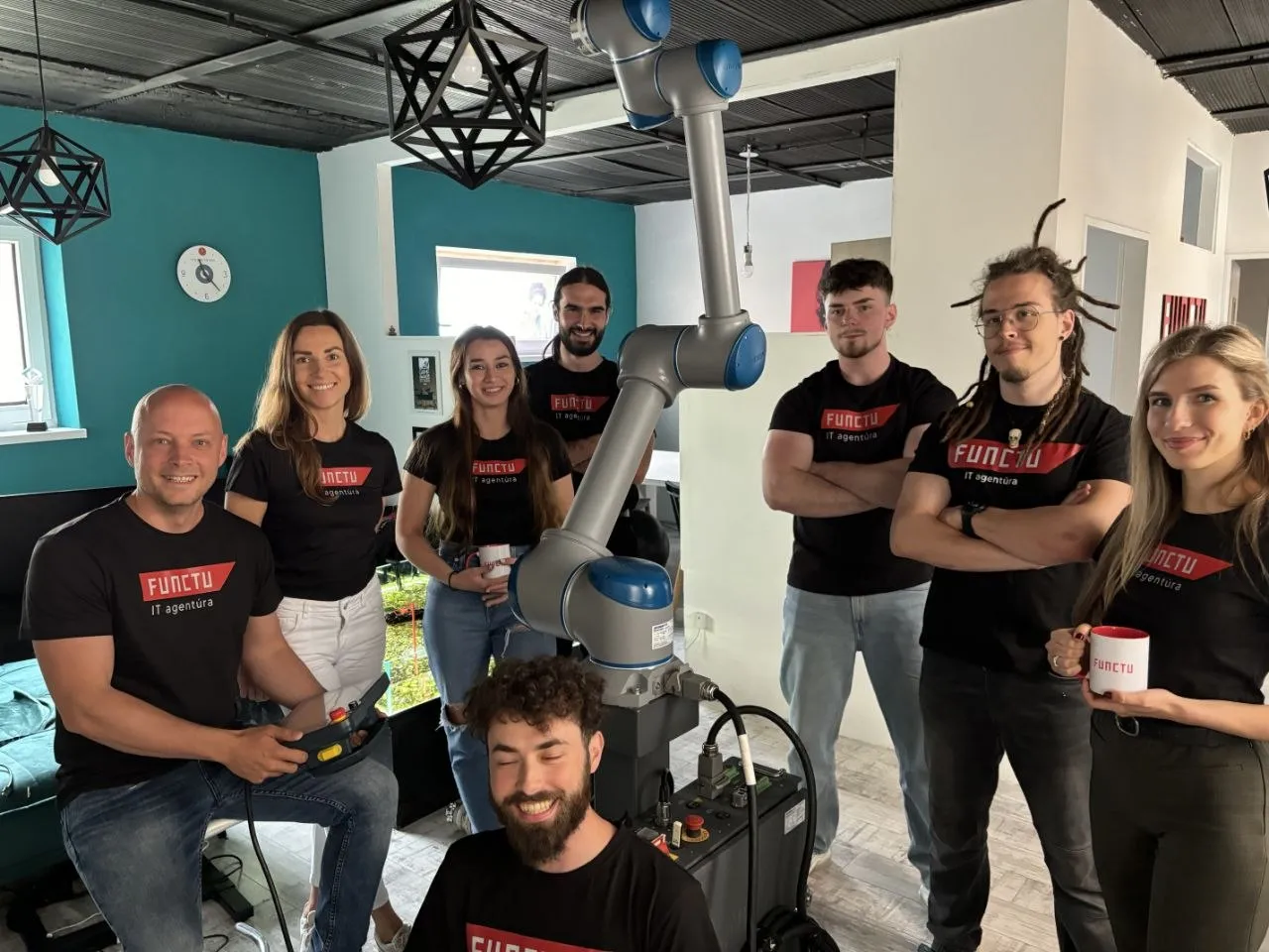FUNCTU team with robot in office