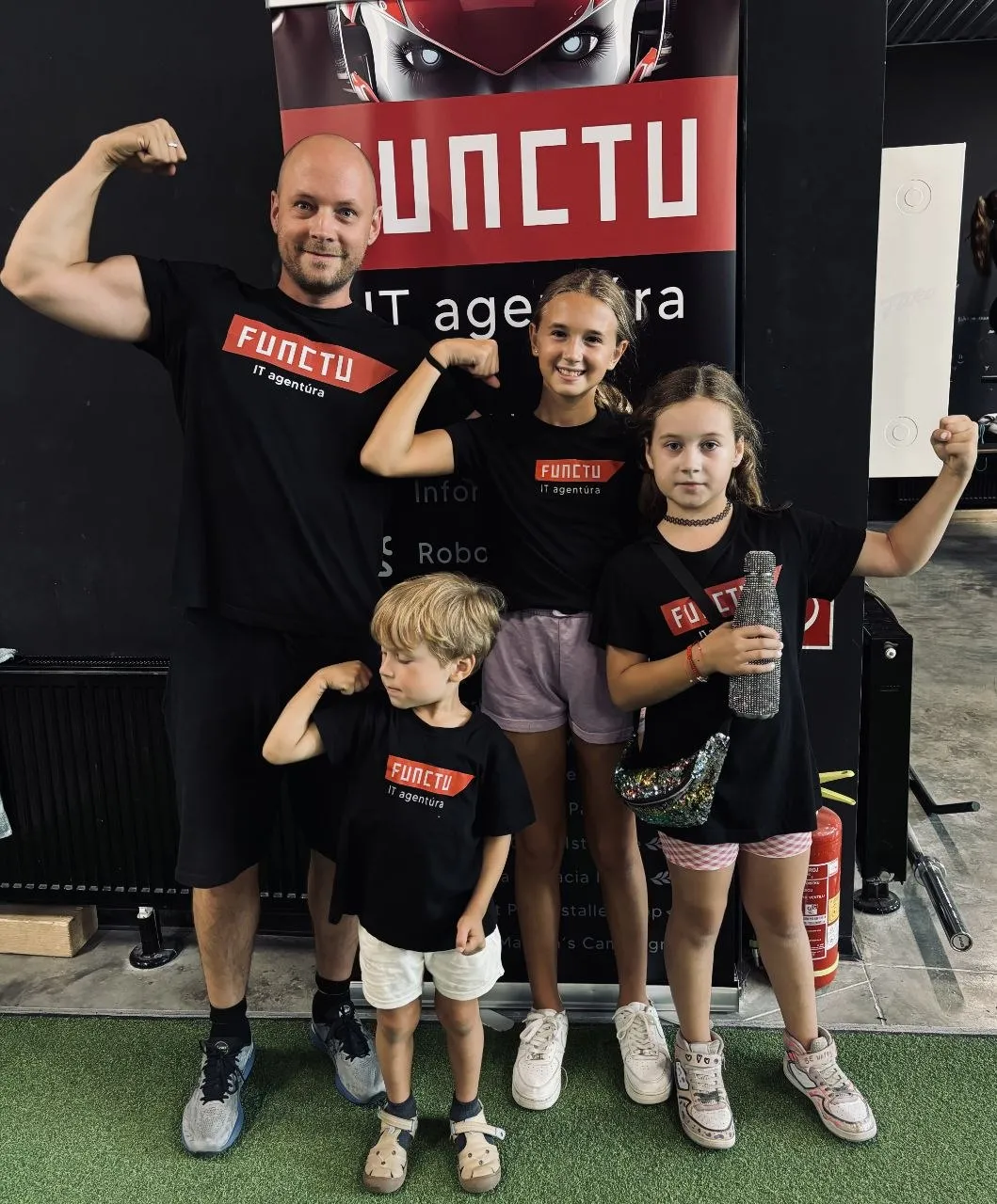 Juraj with children in FUNCTU shirts